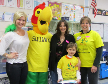 Squawk the mascot of yell and tell with teachers and Heroes